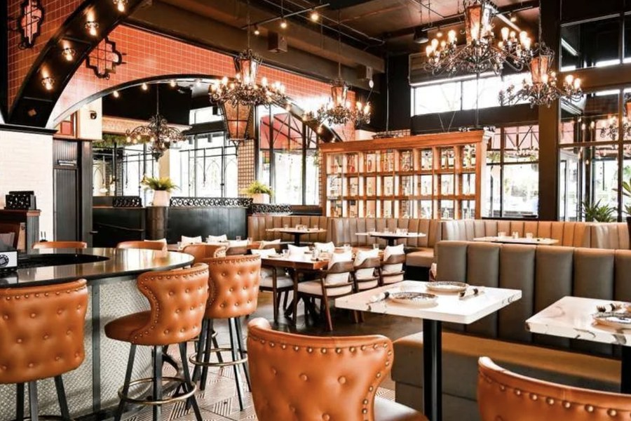 Dining room at Agave Cocina & Tequilas Bothell with chandeliers and leather bar stools
